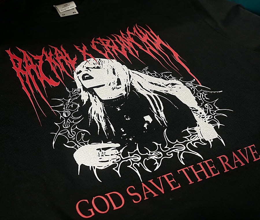 Red and white halftone print reading God Save the Rave on a black shirt
