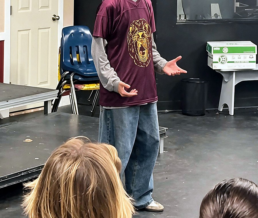 Person wearing a printed maroon tee